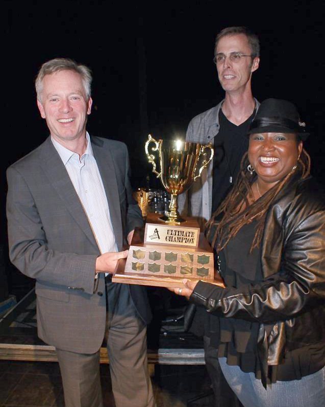 James Temple, Ken Goodwin and Carolyn Thompson holding the Ultimate Champion trophy